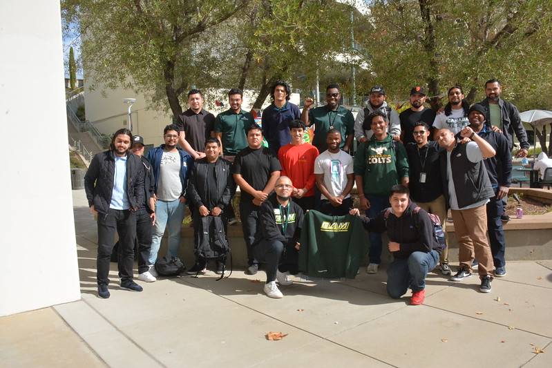 Group of students and staff celebrating at a Fall welcome back event in 2023